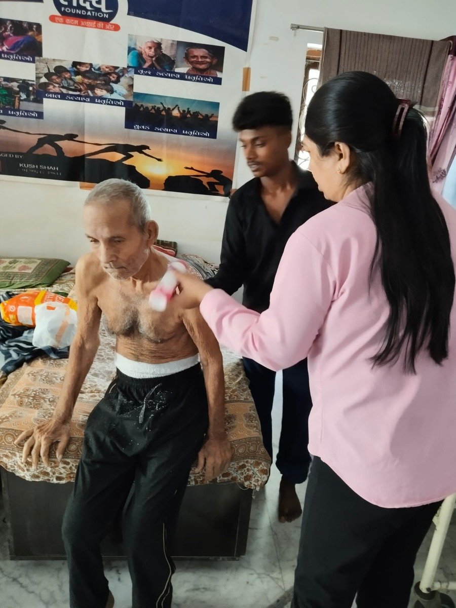 Lakshya Foundation caregivers looking after an elder